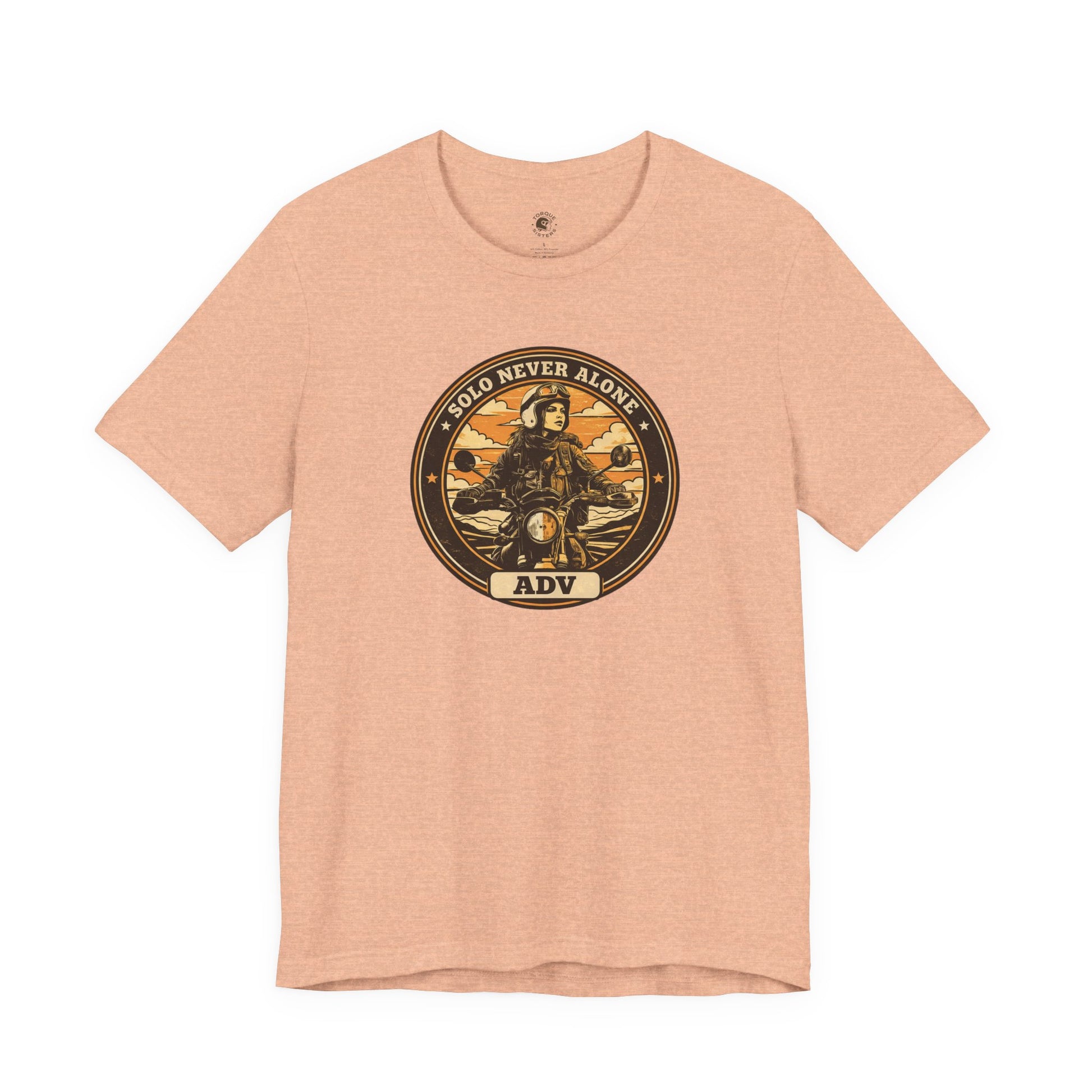Pink t-shirt with a graphic design featuring a person on a motorcycle and text on a white background