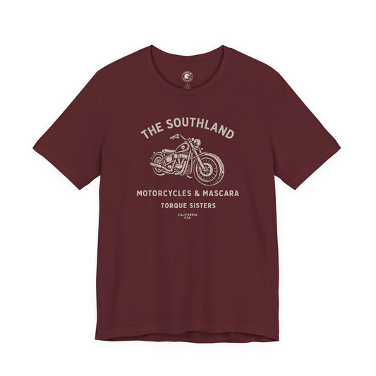 Maroon t-shirt with motorcycle graphic and text on a white background